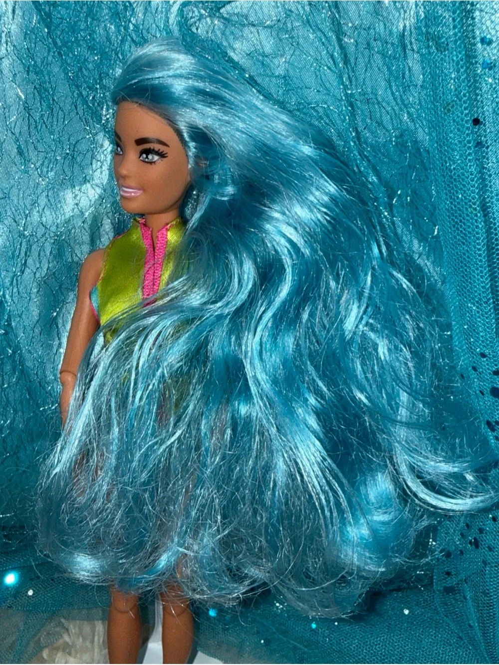 Barbie blue hair shaved head in life jacket top